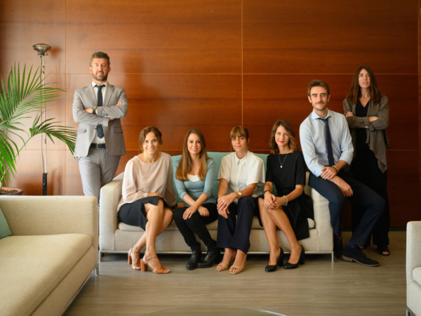 Colleagues sitting on sofa